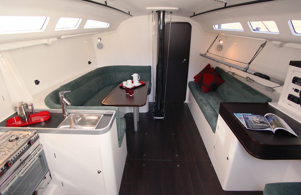 Main cabin with galley to port and nav station to starboard - GTS43  © Crosbie Lorimer http://www.crosbielorimer.com